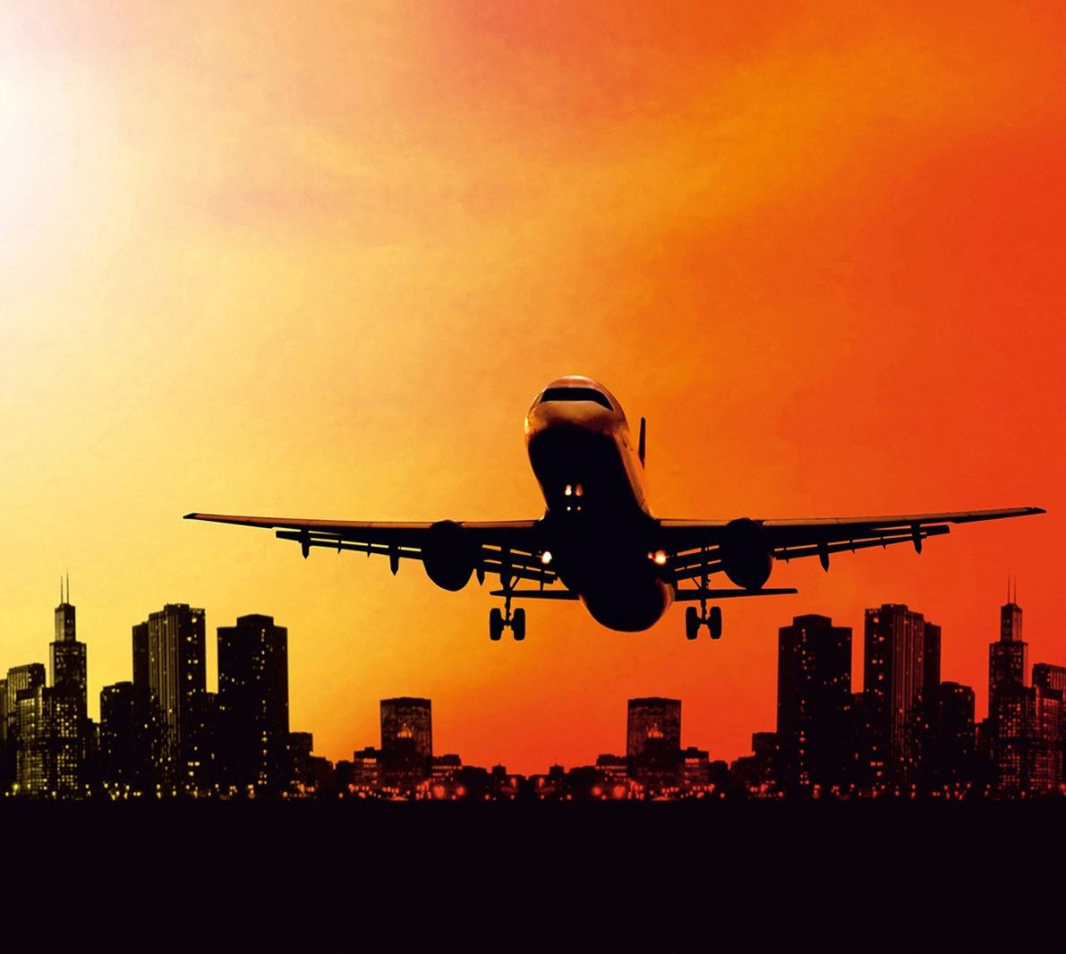 Sunset Departure: Awe-Inspiring Wall Mural with Airplane Taking Off