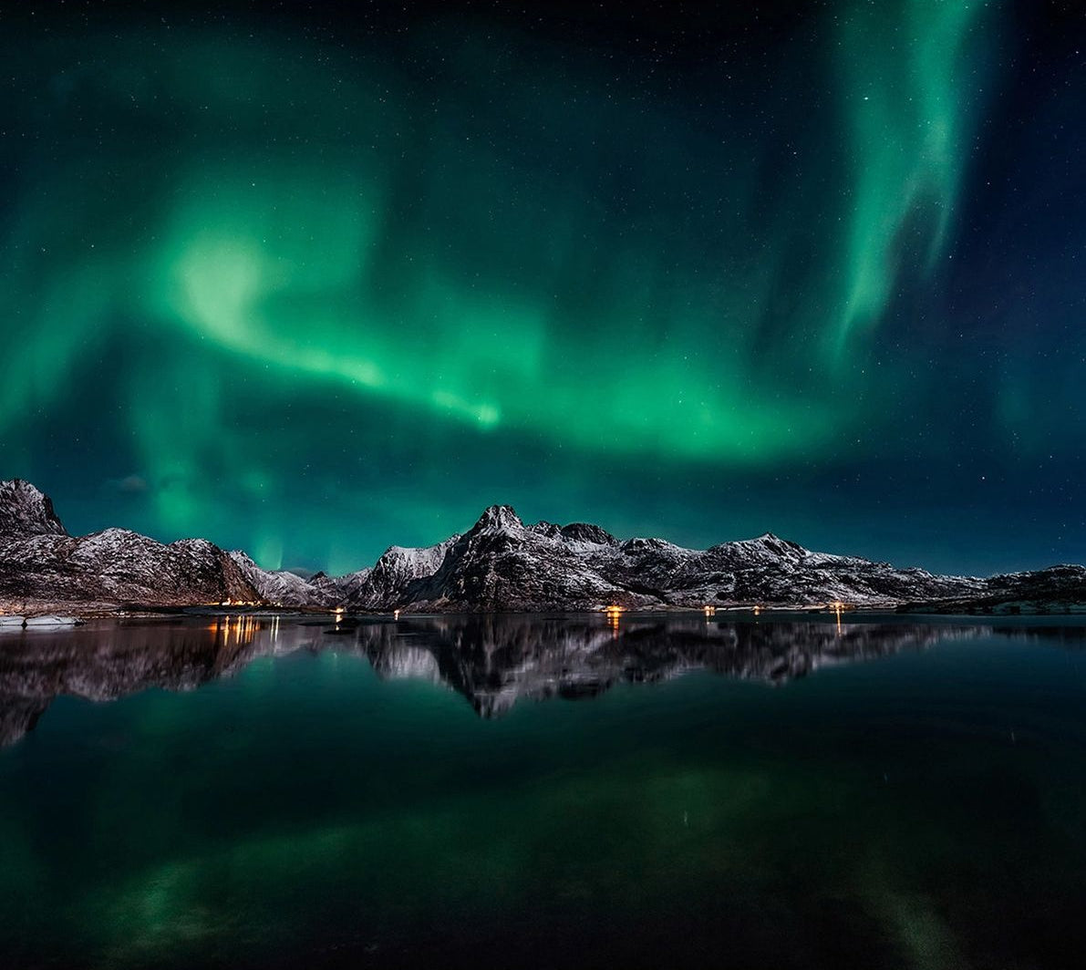 Northern Lights Serenity: Aurora Illuminating Dark Rocks & Water Wall Mural