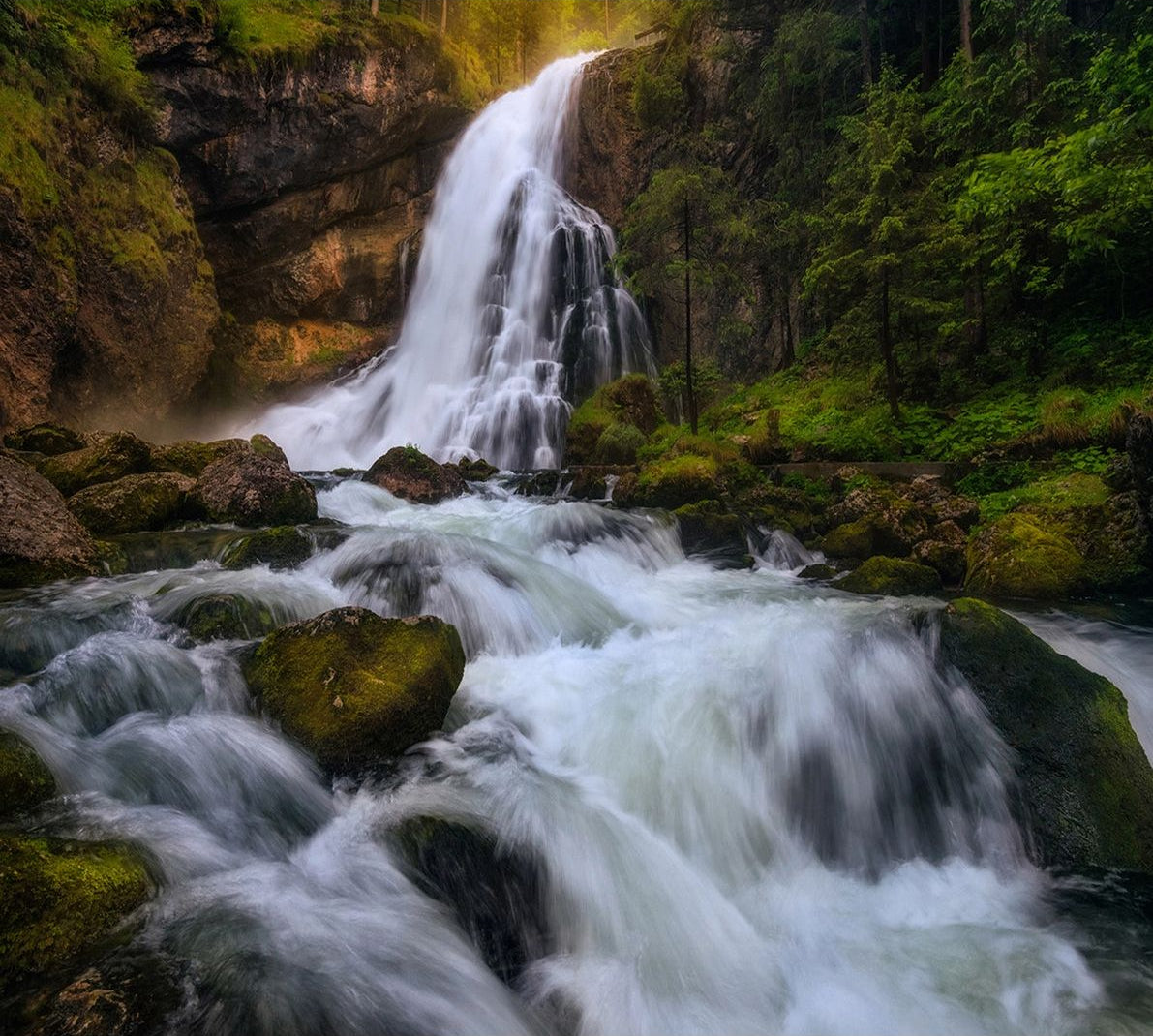 Serene Cascade: Wall Mural of Waterfall on Rocks