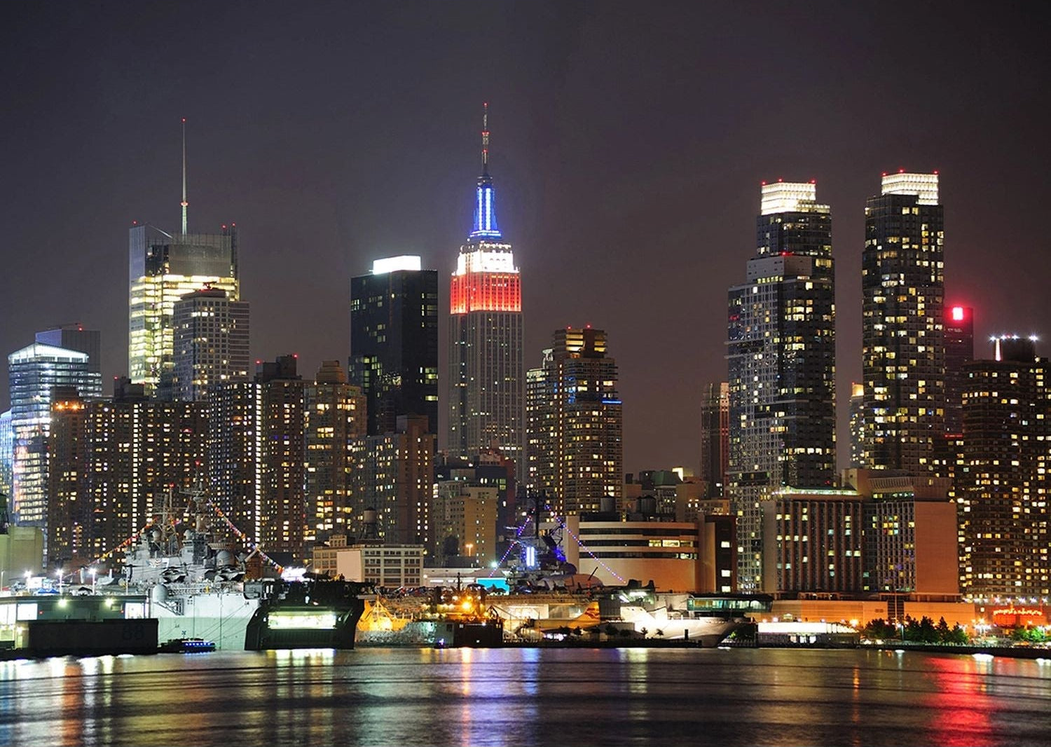 City Lights Majesty: New York Skyline at Night Wall Mural