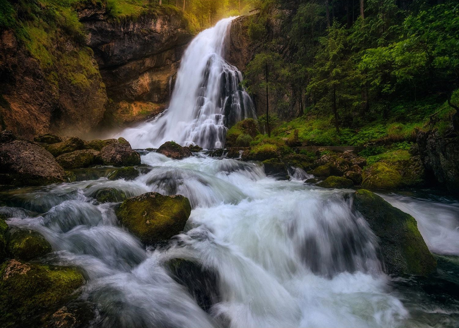 Serene Cascade: Wall Mural of Waterfall on Rocks