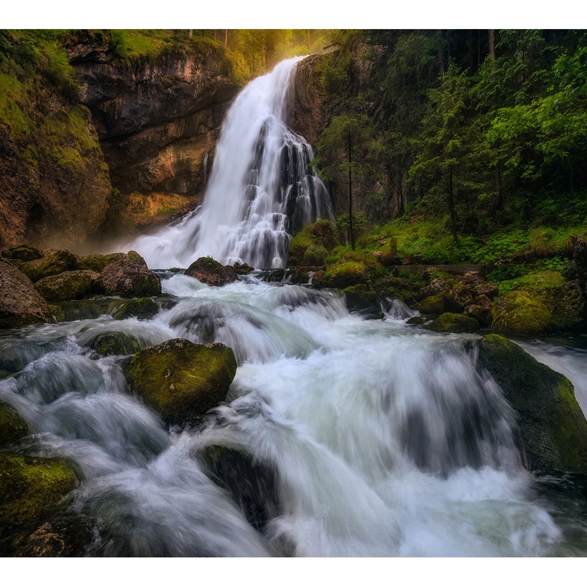 Serene Cascade: Wall Mural of Waterfall on Rocks